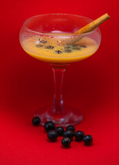 glass of liqueur with berries