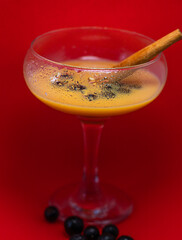 glass of liqueur with berries