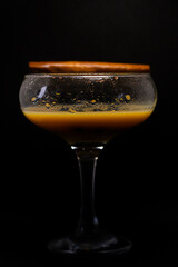 glass of liqueur with berries