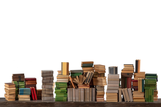 Stacks of many books on a shelf or table on an isolated background. Concept of library, reading, old classic literature