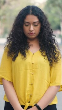 Indian Girl with Curly Hair feeling Guilty