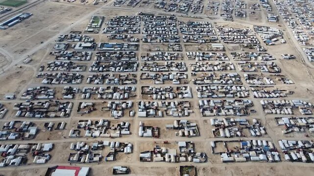 Aleppo, Syria - 01 March 2025: Aerial view of refugee camp in desert landscape, Syria.
