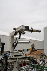 Industrial Processing Unit with Handheld Heating Tools and Wiring – Construction-Site Equipment Detail