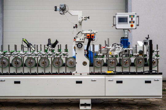 Industrial Processing Unit with Rollers, Handheld Tools and Control Panel – Smart Factory System