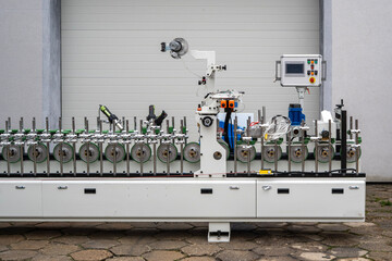 Industrial Machine with Rollers, Clamps and Control Panel &ndash; Factory Equipment Close-Up