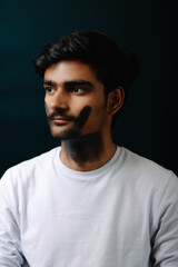 Obraz premium Conceptual portrait of a man with a black handprint on his face, symbolizing silence, social issues, and emotional awareness in an artistic style.