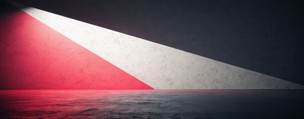 Abstract interior with red and white light illuminating a concrete wall and reflective floor area
