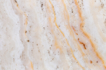 Elegant white marble texture with golden veining and mineral specks, perfect for backgrounds, tiles, and interior decor elements.