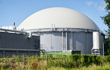 Biogas plant showing a large tank storing renewable energy, contributing to sustainable agriculture...