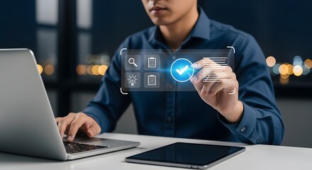 Focused professional uses laptop and modern technology to check off tasks, achieving project success in a business setting at the office.