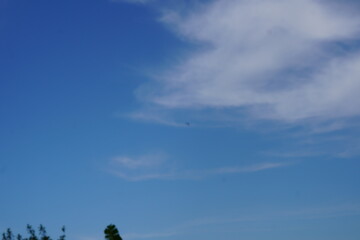 clear blue sky with some white clouds in the sky 