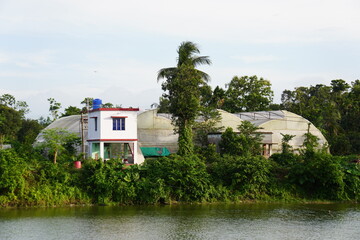 greenhouse and watch tower besides on the lake