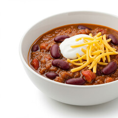 Delicious Bowl of Chili Topped with Sour Cream and Cheddar Cheese Isolated.