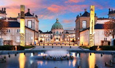 Copenhagen - Beautiful fountain at the Royal Danish Palace Amalienborg at dramatic sunrise. Royal...