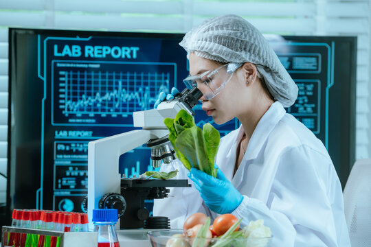 A food scientist conducts research and analysis in a laboratory, focusing on nutrition, safety, and quality control of fresh produce to promote health and sustainable agriculture. - Powered by Adobe