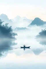 霧深い山の湖でボートを漕ぐ人の穏やかな風景 静かな水面のリフレクション
