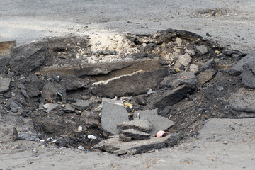 broken by explosion asphalt in Kyiv Ukraine