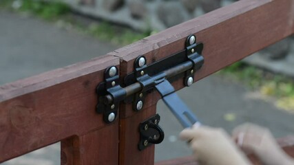 Little girl opens hasp