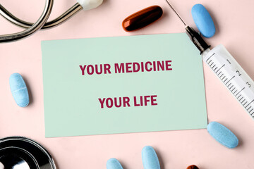 The conceptual phrase is YOUR MEDICINE YOUR LIFE. Invest in your health Concept.