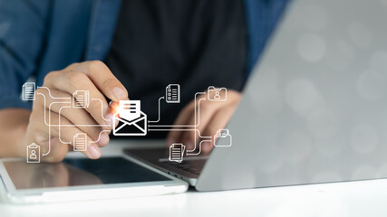 Businessman using digital devices with email communication and document sharing workflow icons for digital collaboration, data management, and cloud technology.