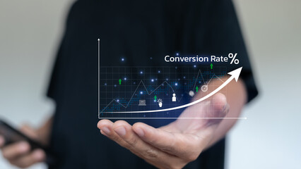 Businessman analyzing conversion rate optimization with digital marketing analytics graph for online business growth, sales performance, and e-commerce success strategy.