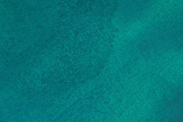 emerald color backdrop: close up of canvas stained with green and blue paints