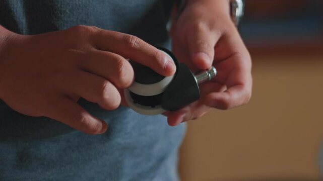 Close-Up of Hands Holding a Modern Gadget