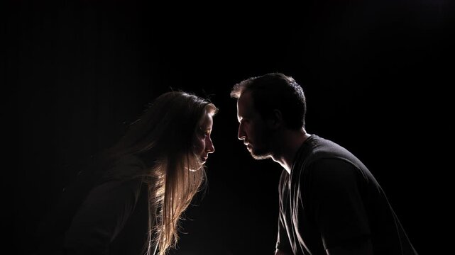 Couple are aggressively and defiantly trying to dominate one over the other