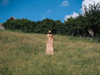 Exploring pagan culture in Opishnia, Poltava region of Ukraine with stone sculptures in a lush landscape