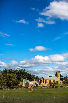 An old sandstone church amongst paddocks