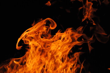 Orange fire flames flickering in the night