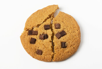 Slices of one large craft chocolate chip cookie on white background. Isolated. Flat lay