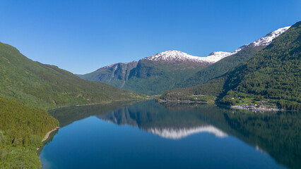 Snow-Capped Mountains Reflected in Lake Lovatnet, Loen, Norway