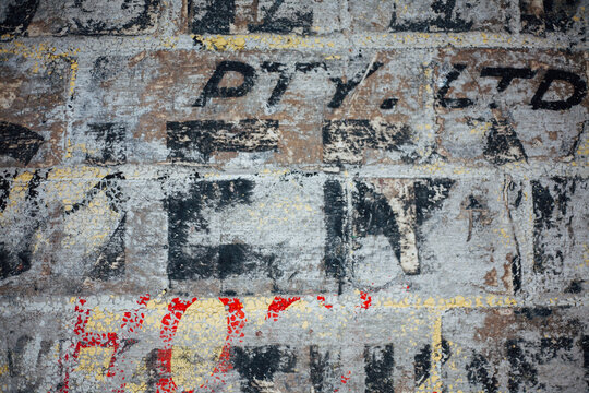 Ghost signage on brick wall