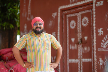 indian farmer standing confidently