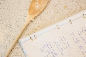 Handwritten recipe book open to ANZAC biscuits