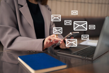 Email notification concept, Female use smartphone and laptop receive message alert in the mailbox.
