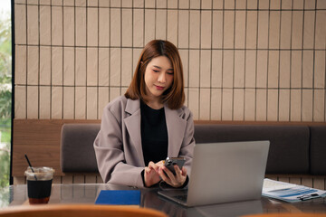 Email notification concept, Female use smartphone and laptop receive message alert in the mailbox.