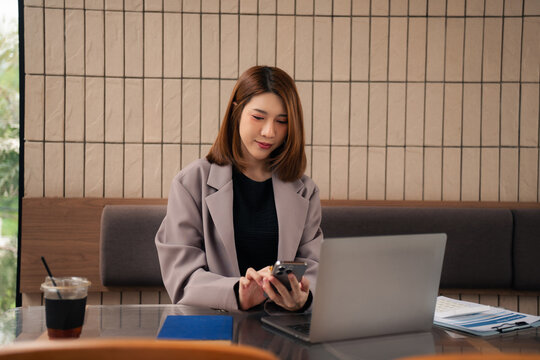 Email notification concept, Female use smartphone and laptop receive message alert in the mailbox.