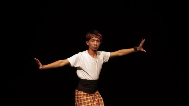 Dancer in Traditional Attire Performing on Stage