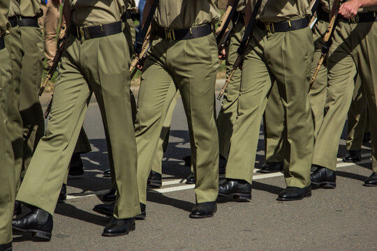Soldiers marching down the street in the ANZAC Day parade
