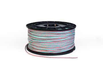Roll of polypropylene rope, knitted cord isolated on white background.