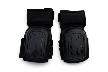 Black construction protective knee pads isolated on white background.