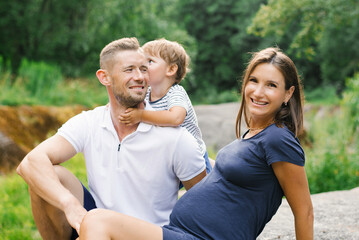 Closeup Of Happy Family Smiling In Summer Forest