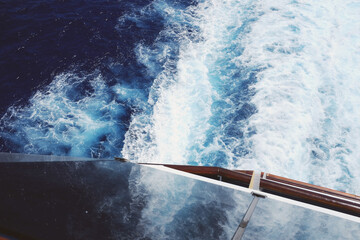 Elevated view down towards water behind a cruise ship