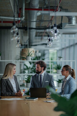 Business team discussing strategy in modern office meeting