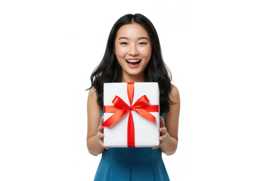 A happy asian woman holds a gift box with a red ribbon and smiles isolated on transparent background