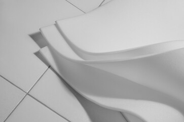 three sheets of thin white foam material on the floor of the room

