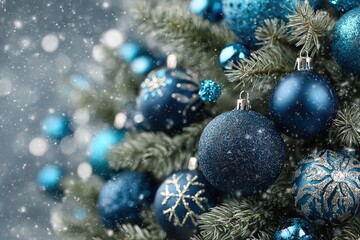 Blue and silver Christmas ornaments decorate a festive tree with soft lighting and blurred background.