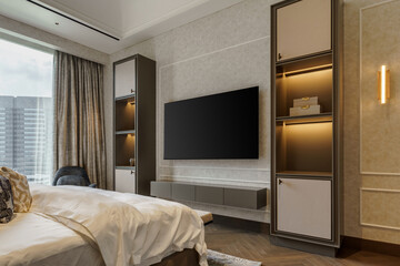 Luxurious and modern master bedroom with a large bed facing a custom entertainment wall. Features built-in shelving with lighting and a large window.